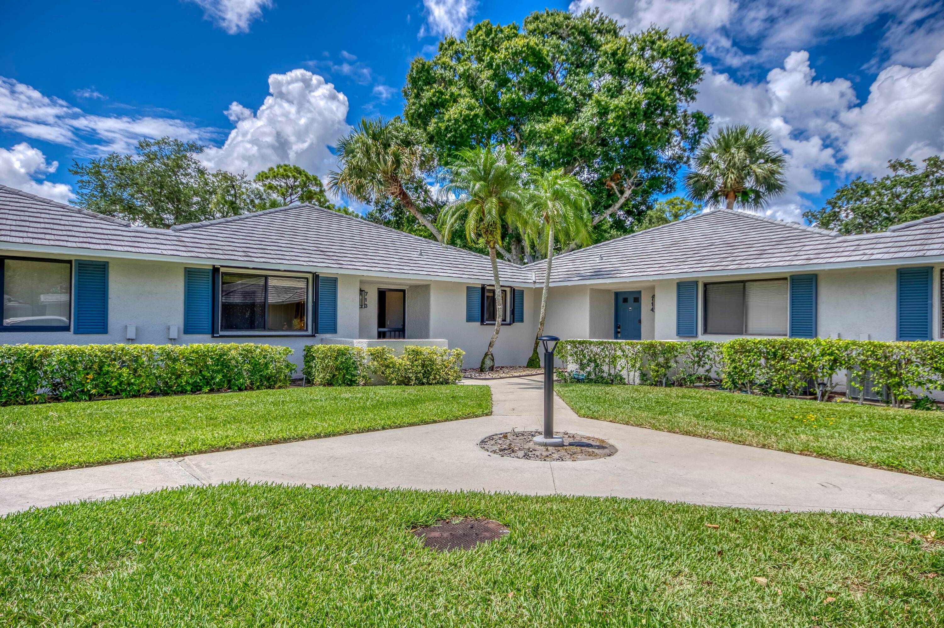 Located in the highly desirable Club Cottages community within PGA National, this charming 2 bedroom, 2 bath corner unit offers the perfect blend of comfort, convenience, and investment potential.