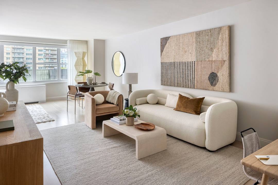 Discover this bright, 748 square foot studio with a dinning alcove at 155 West 68th Street.