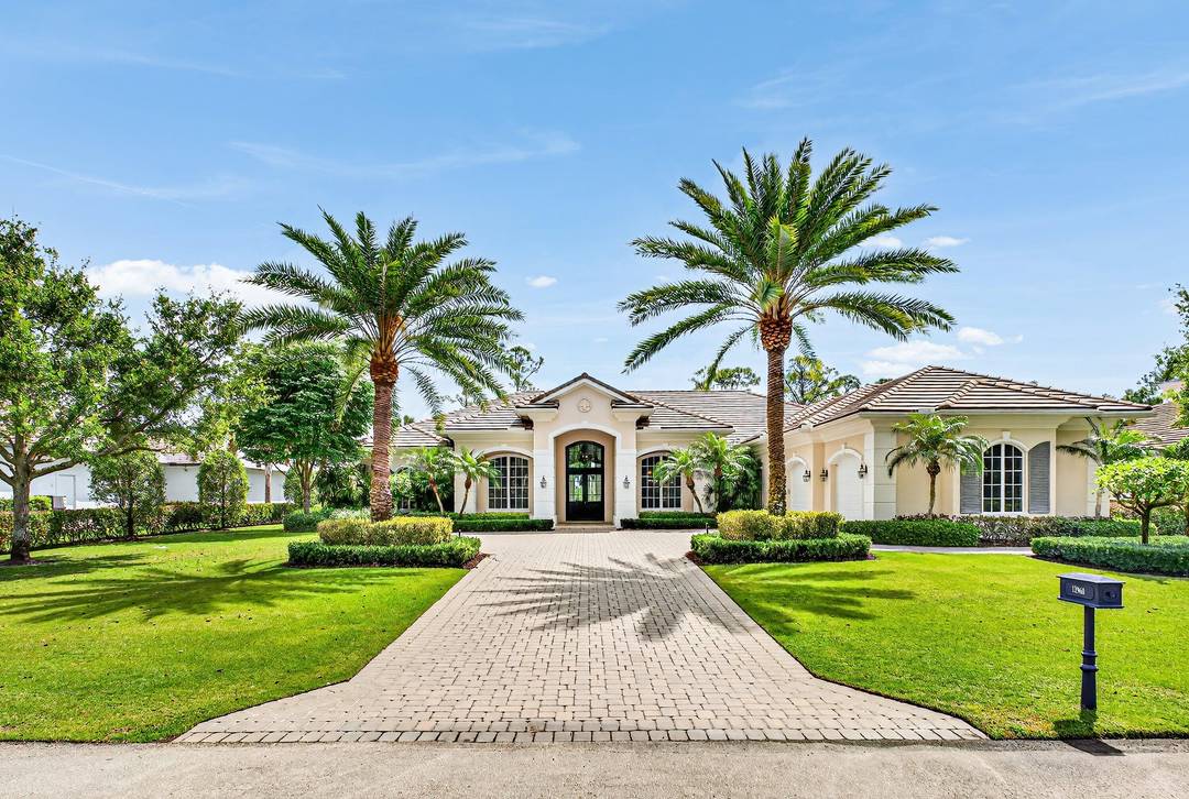 This recently built and meticulously maintained custom home sits on nearly two thirds of an acre on a quiet cul de sac in prestigious Old Marsh Golf Club.