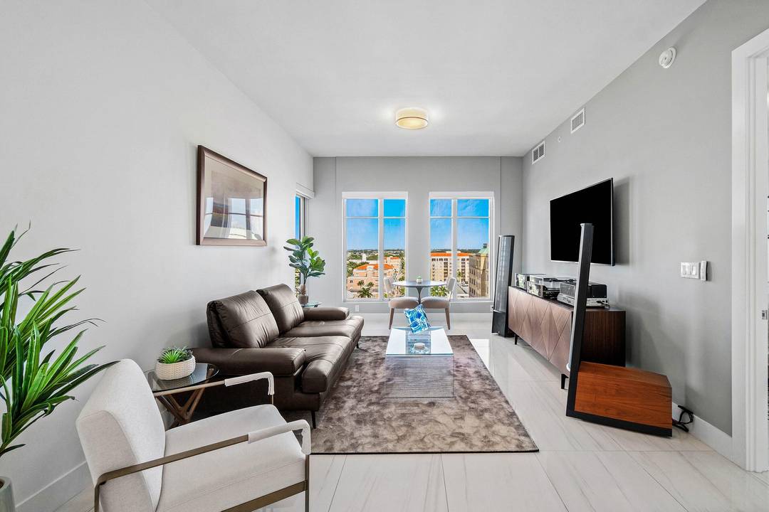 Experience captivating northeast ocean and sweeping northwest city views from this impeccably appointed 11th floor corner residence in the heart of downtown Boca Raton.