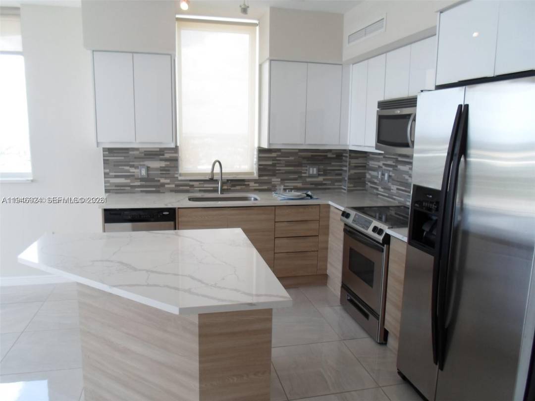 Spacious, updated and bright corner 2 bedroom, 2 bathroom condo in the heart of Hallandale Beach.