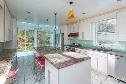 This Frank Lloyd Wright inspired home built circa 1938 is a unique North Riverdale Treasure.