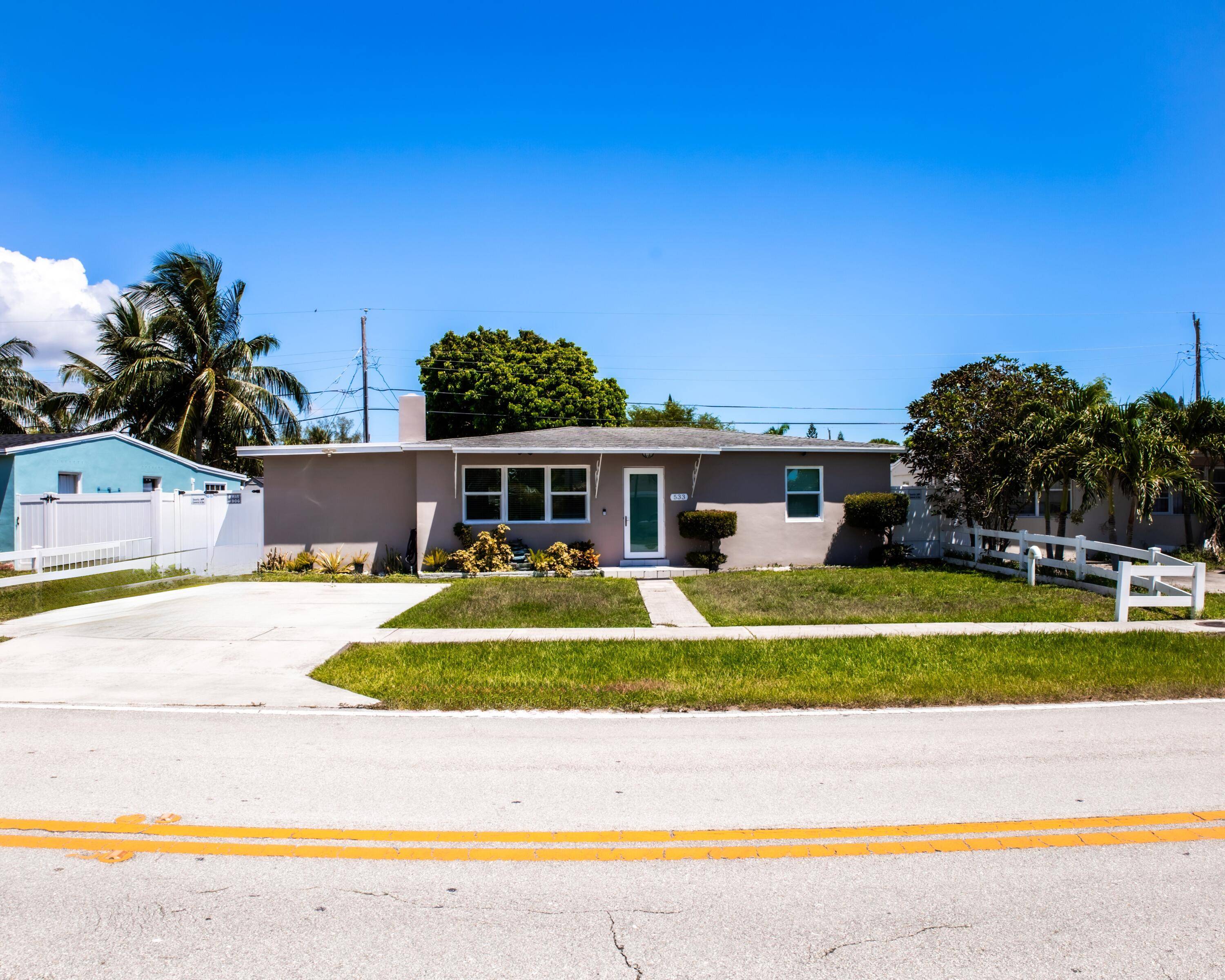 Welcome to this beautifully renovated 3 bedroom, 1 and 1 2 bath single family home in West Palm Beach.