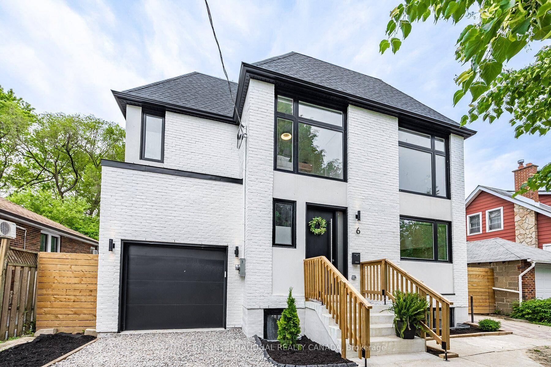 Indulge in lakeside luxury at this newly built custom property, where contemporary design meets serene natural beauty.