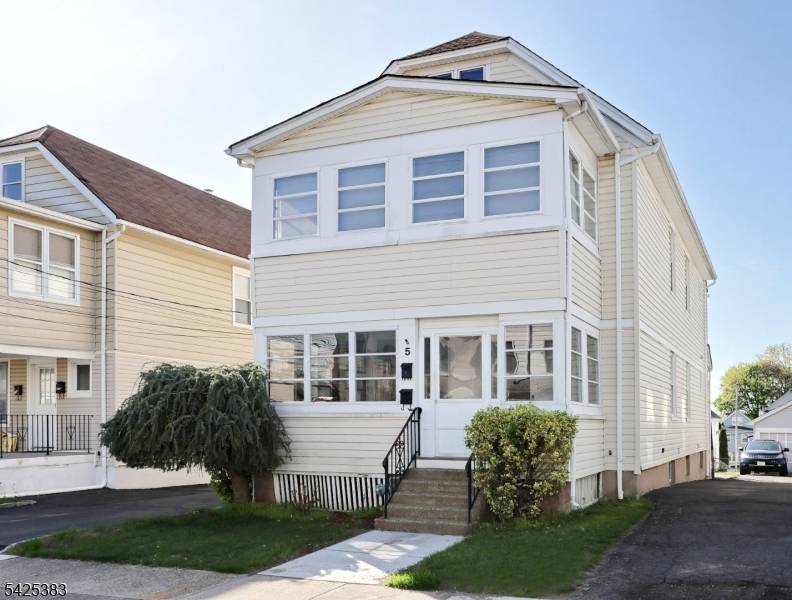 Solid 5 bedroom 2 Family on a deep lot with an oversized 2 car garage with off street parking for 8 plus cars located less than a mile from NJ ...