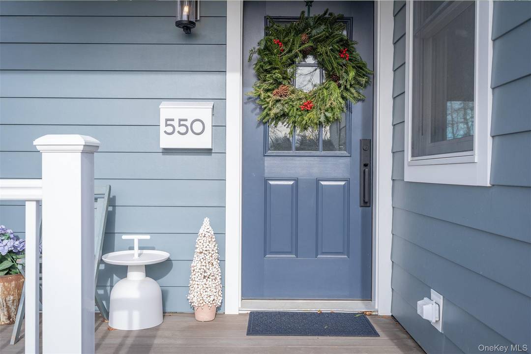 Okay, so the first thing, you get out of the car and this farmhouse style has the front porch that actually has room for a side table and chair to ...
