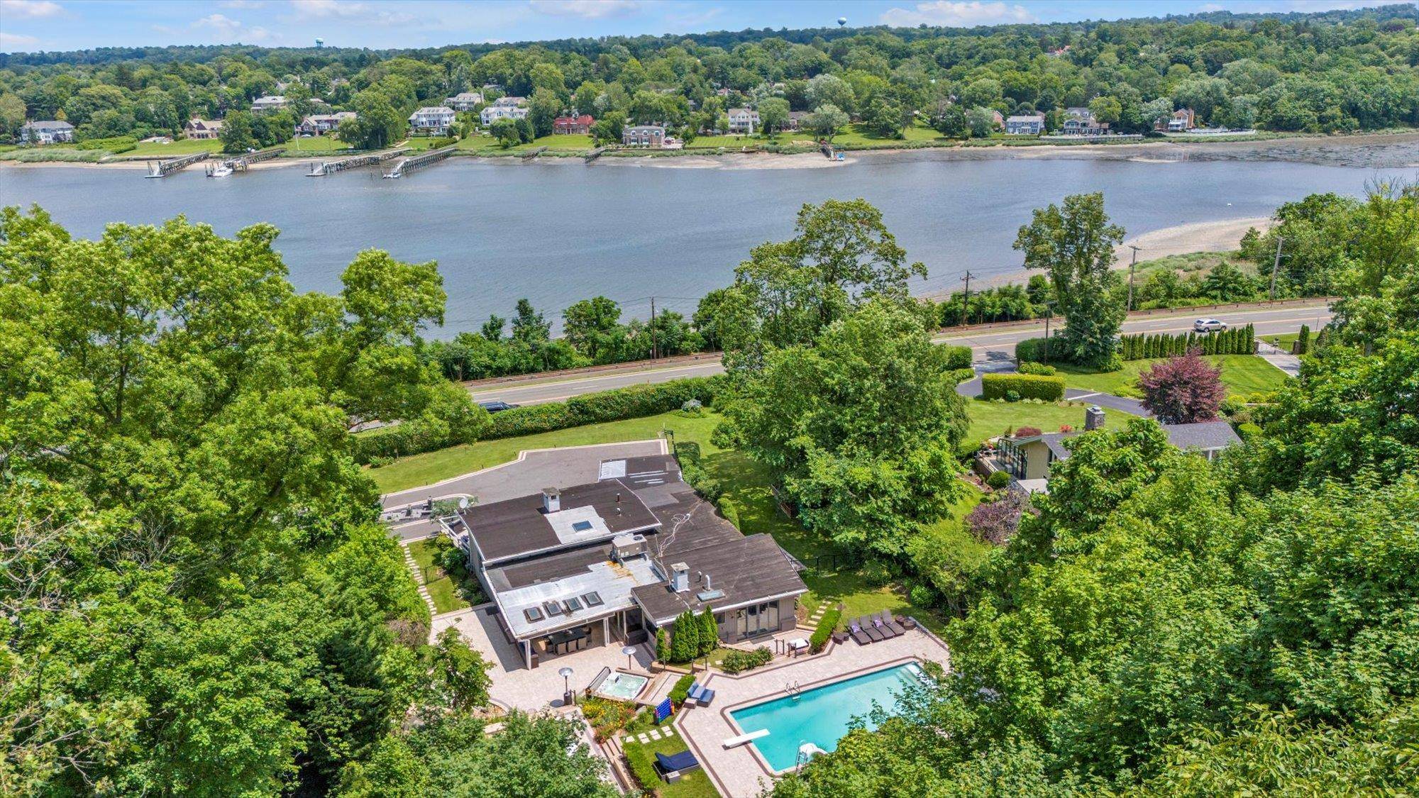 KINGS POINT CONTEMPORARY RANCH WITH UNOBSTRUCTED WATER VIEWS Discover the Perfect Blend of Modern Elegance and Resort Style Living Set On A Beautifully 1 Acre Landscaped Property with a Circular ...