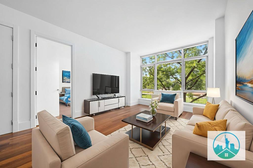 Enjoy sweeping views of McCarren Park from this spacious, luxury 1 bedroom with deeded parking !