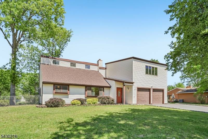 Move right into this bright and airy home featuring a highly desirable first floor primary suite and thoughtful updates throughout.