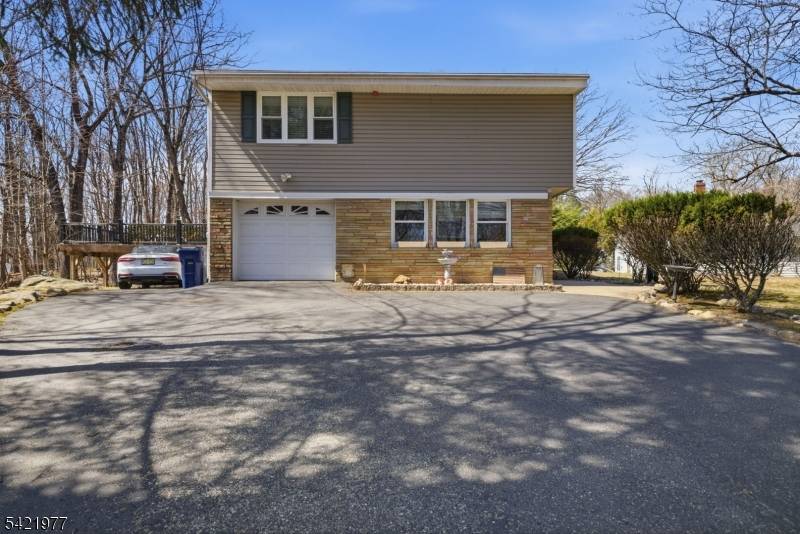 Situated on a beautifully maintained half acre corner lot, this immaculate home offers exceptional space, versatility, and thoughtful design throughout.