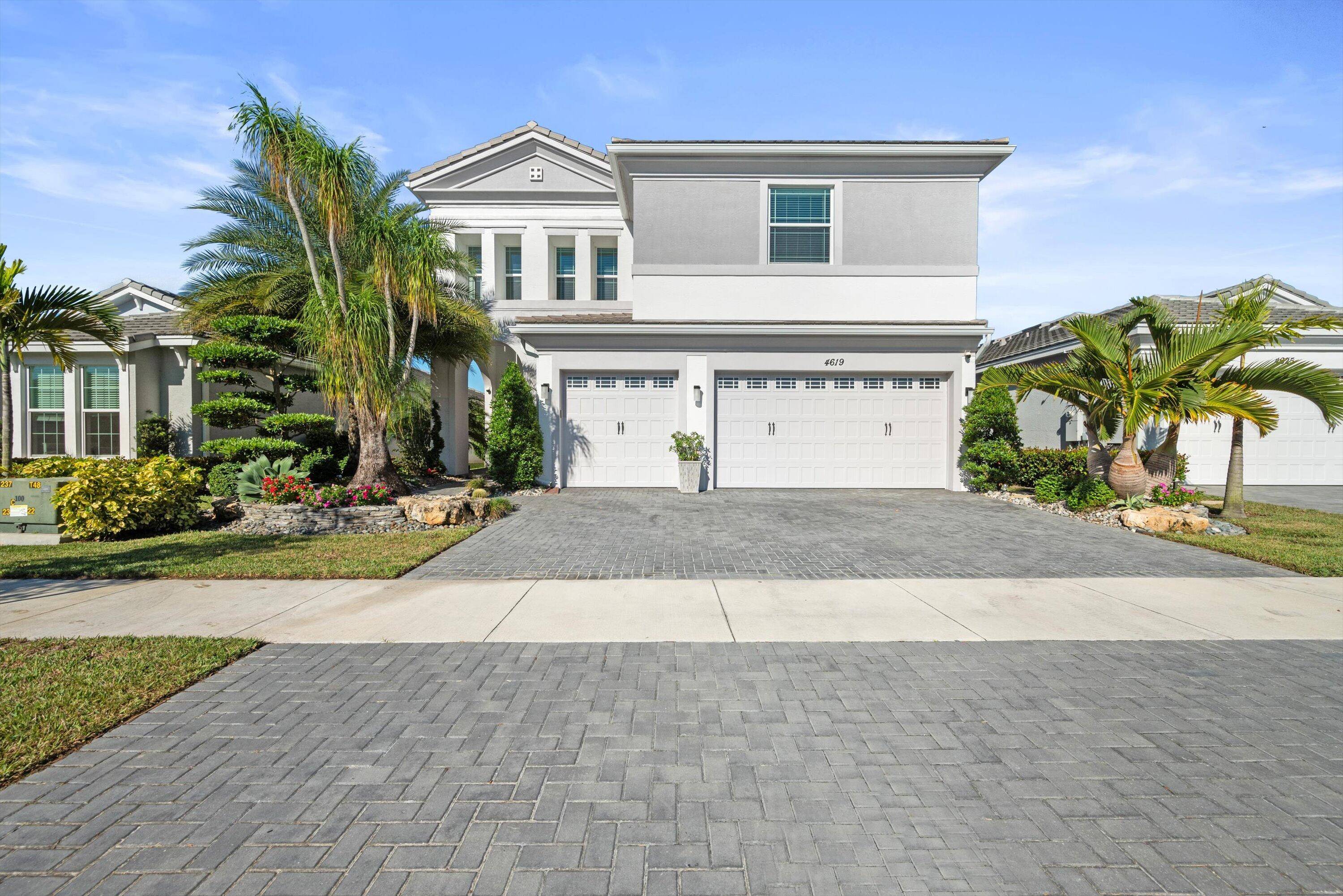 Welcome to this meticulously designed 5 bedroom, 4 bathroom, 3 car garage home located in the highly sought after community of The Groves at Westlake, offering breathtaking lake views.