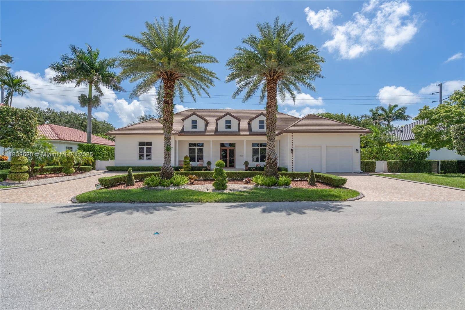 Luxury 1 story residence with soaring 12 18' ceilings and impact resistant windows doors.