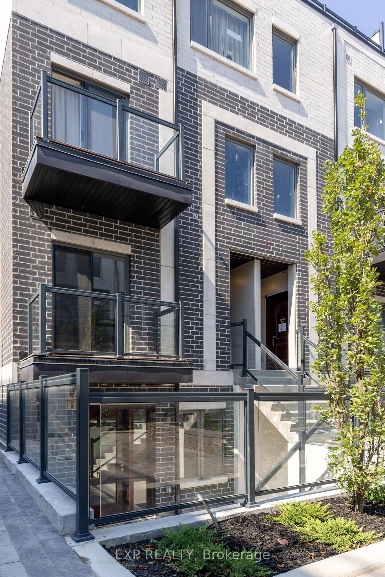 Very spacious, this luxurious end unit 2 bed, 2 bath condo townhouse features laminate floors and stainless steel appliances in the modern kitchen.