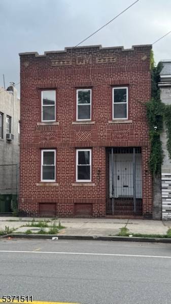 Charming and Updated Full Brick 2 Family Home with Off Street Parking !