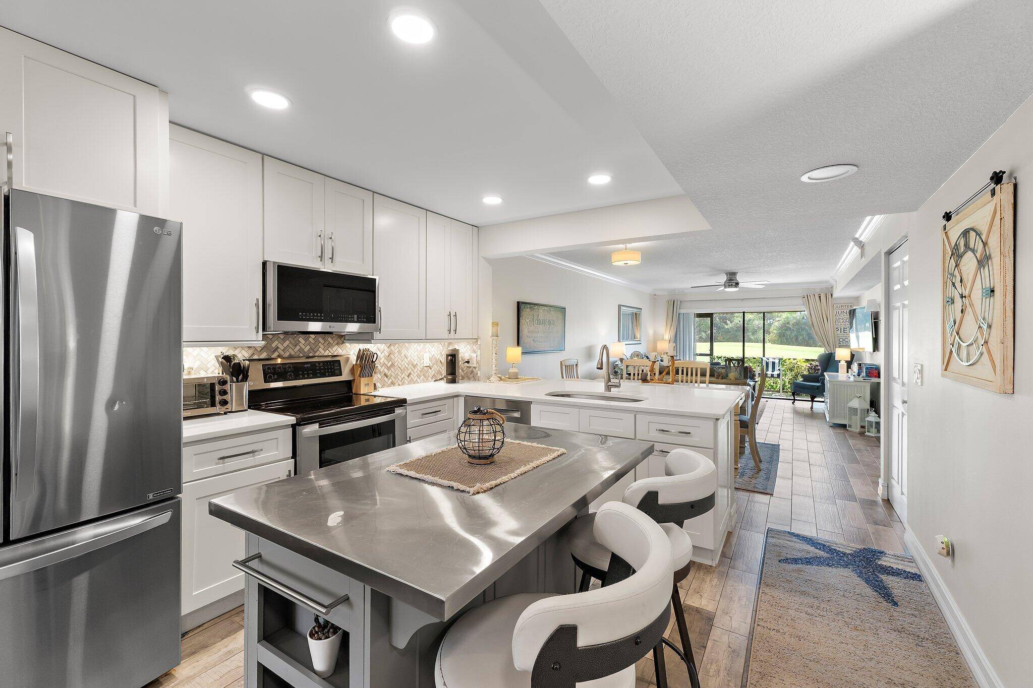 Beautifully renovated and move in ready, this stunning home offers golf course views right from your patio on the 18th hole.