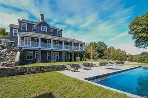 One of the few properties on Lake Waramaug with long views of both the lake, distant hills, Hopkins Vineyard, and private waterfront dockage.