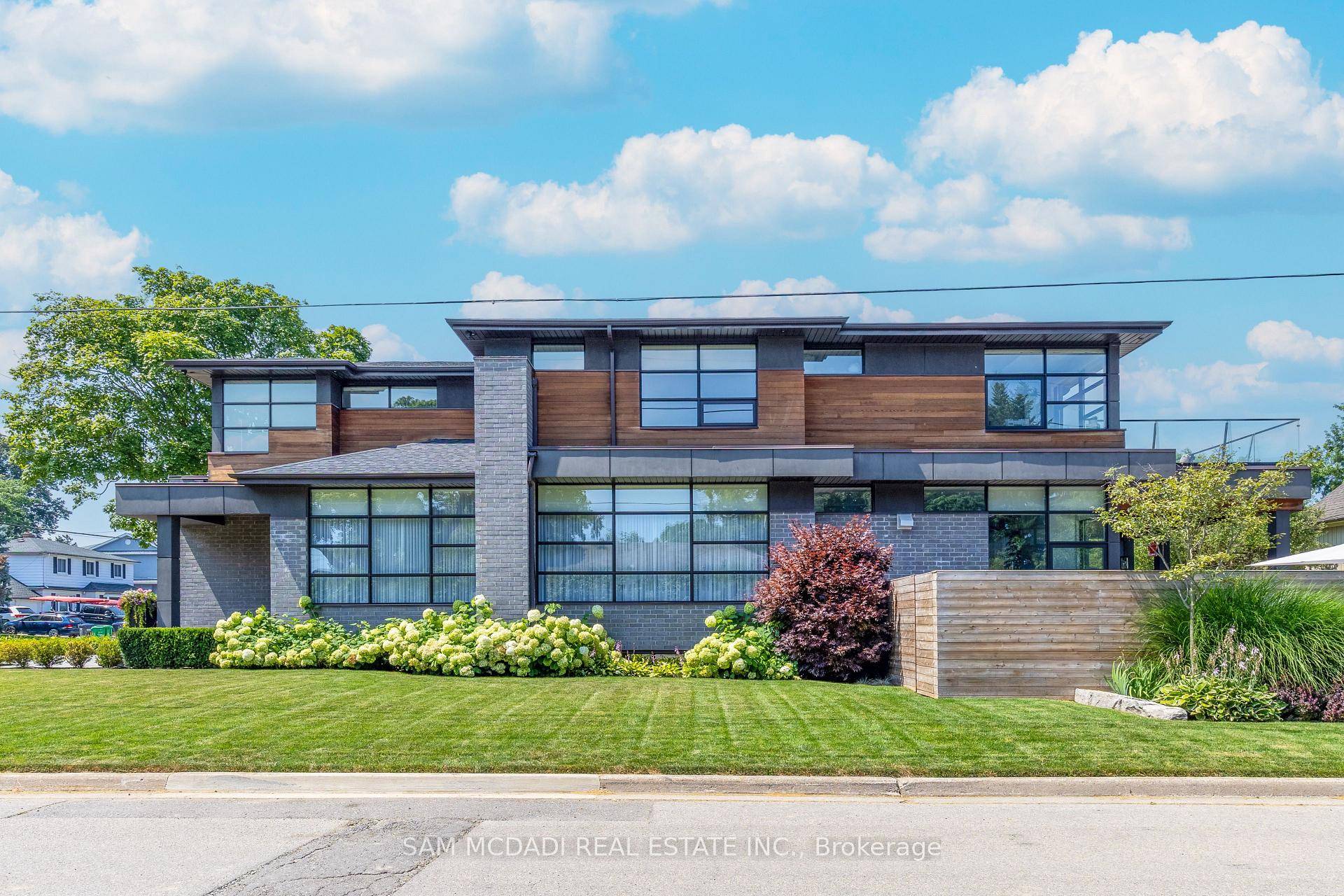 This custom built modern home, inspired by West Coast design, is situated south of Lakeshore in the highly sought after Port Credit Village area of Mississauga.