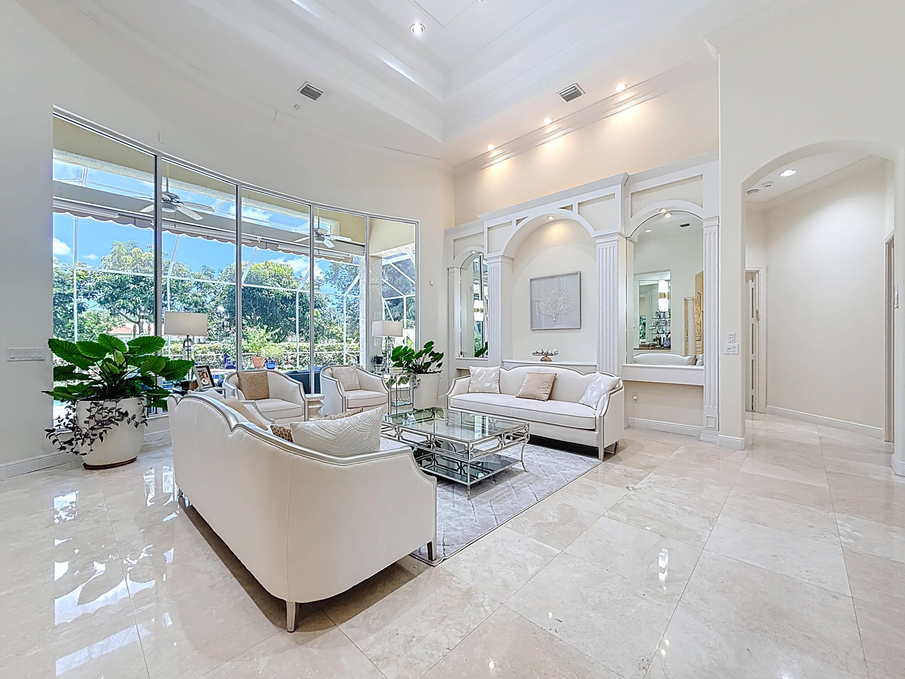 Luxurious and spacious residence with magnificent architecture exquisite designer finishes in the prime part of Boca Grove Country Club.
