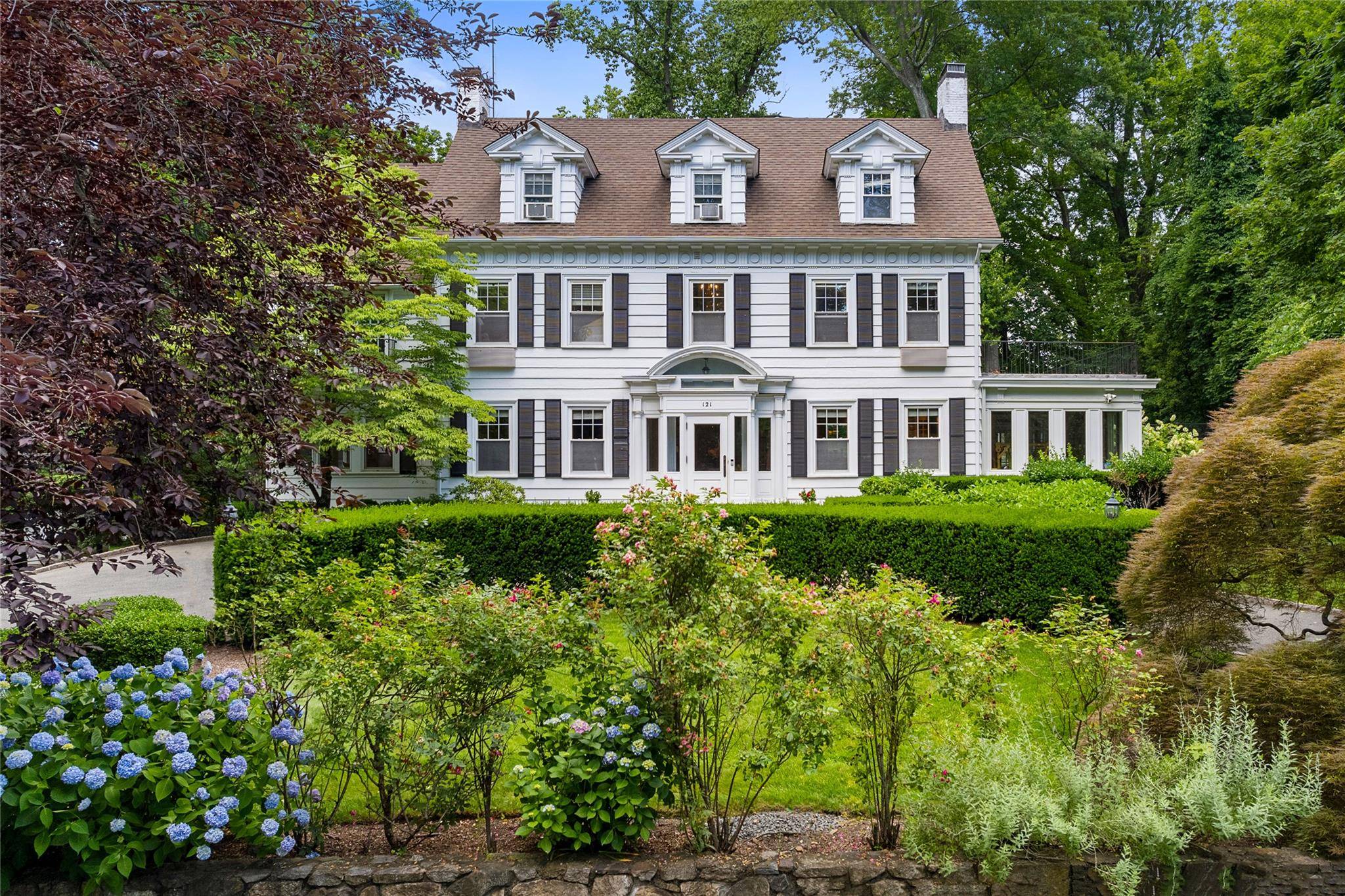 Located in the Beechmont neighborhood of New Rochelle, this center hall colonial home sits on 0.