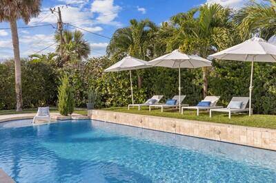 Discover the perfect blend of modern and laid back coastal living in this cool and casual Miami style oceanside residence, located on an oversized corner lot, just steps from the ...