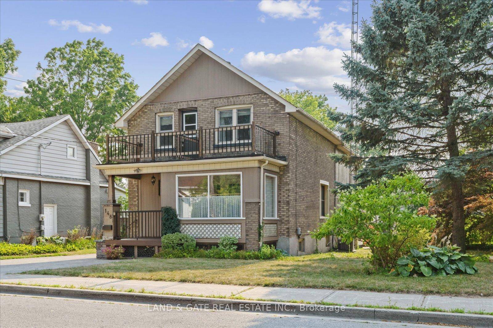Spacious Multi Entrance Home on a Double Wide Lot with Detached Garage.