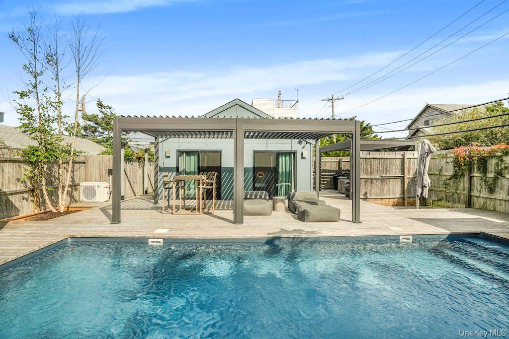 Welcome to this beautifully newly renovated charming 2 bedroom, 1 bath cottage that perfectly blends classic beach living with modern luxury.