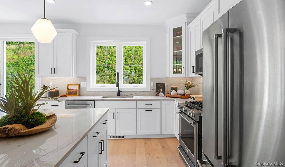 Winter 2025 2026 Completion The Colgate's main living level offers views of the beautiful great room and dining room from its airy two story foyer.