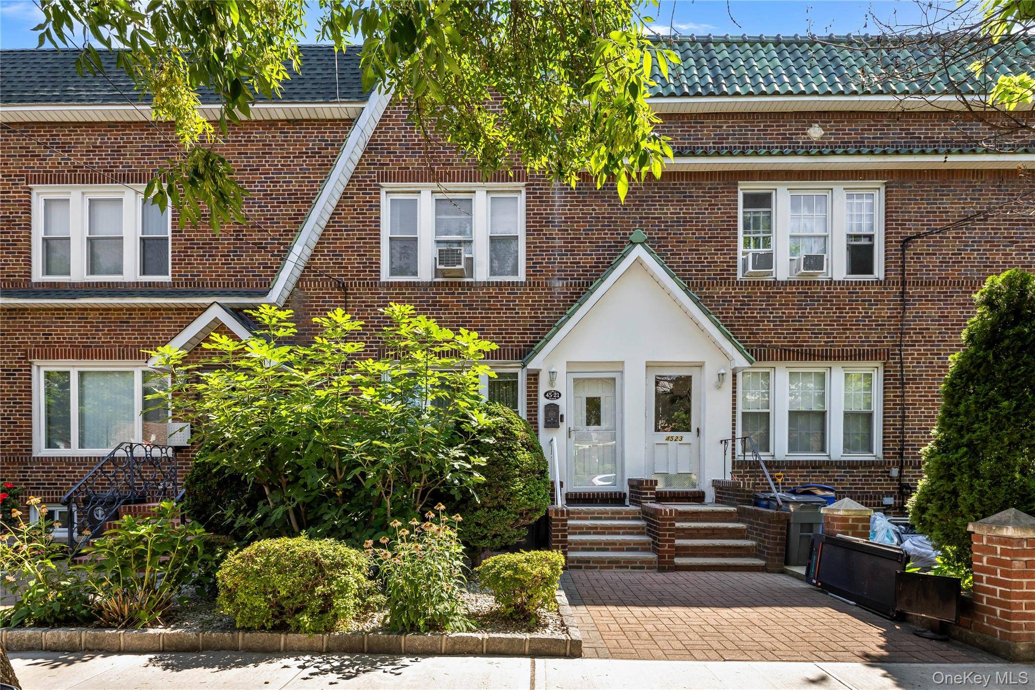 Charming and cozy all brick townhouse located in the heart of Bayside.