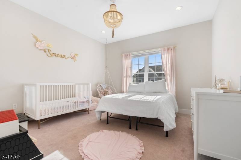 Experience modern townhouse living at 4 Aspen Dr, located in the Hilltop at Cedar Grove community.