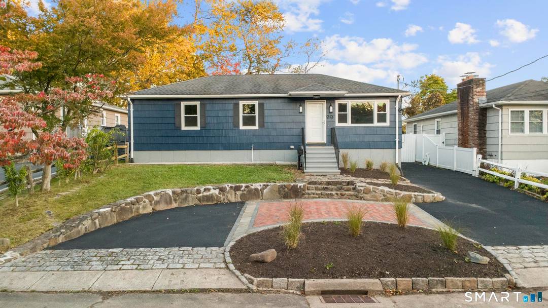 Pull into your charming half circle driveway and instantly fall in love with this home's incredible curb appeal.