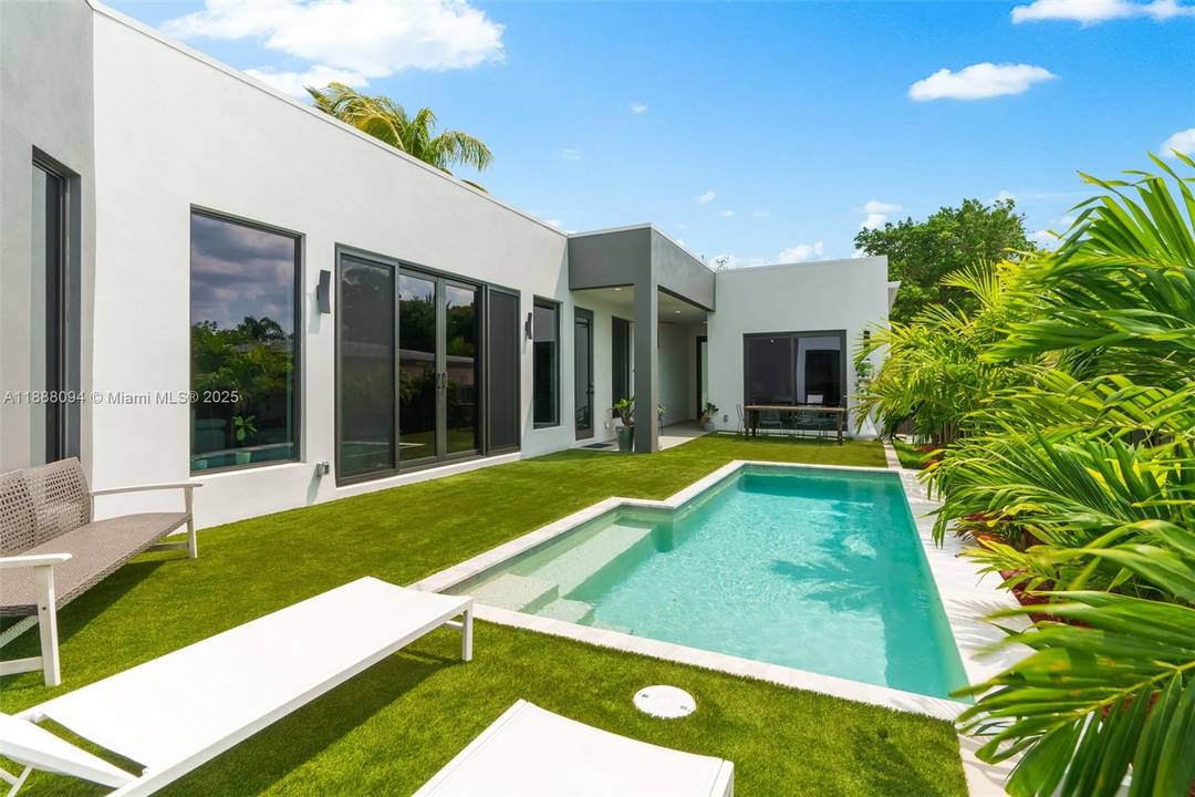 This modern new construction home outside flood zone offers 4 bedrooms, including a detached cabana with kitchenette and ensuite bath that doubles as a proven income generator.