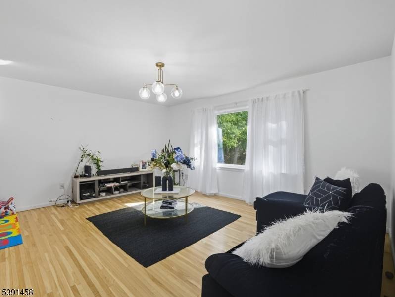 Beautifully maintained two family home in desirable Woodland Park !