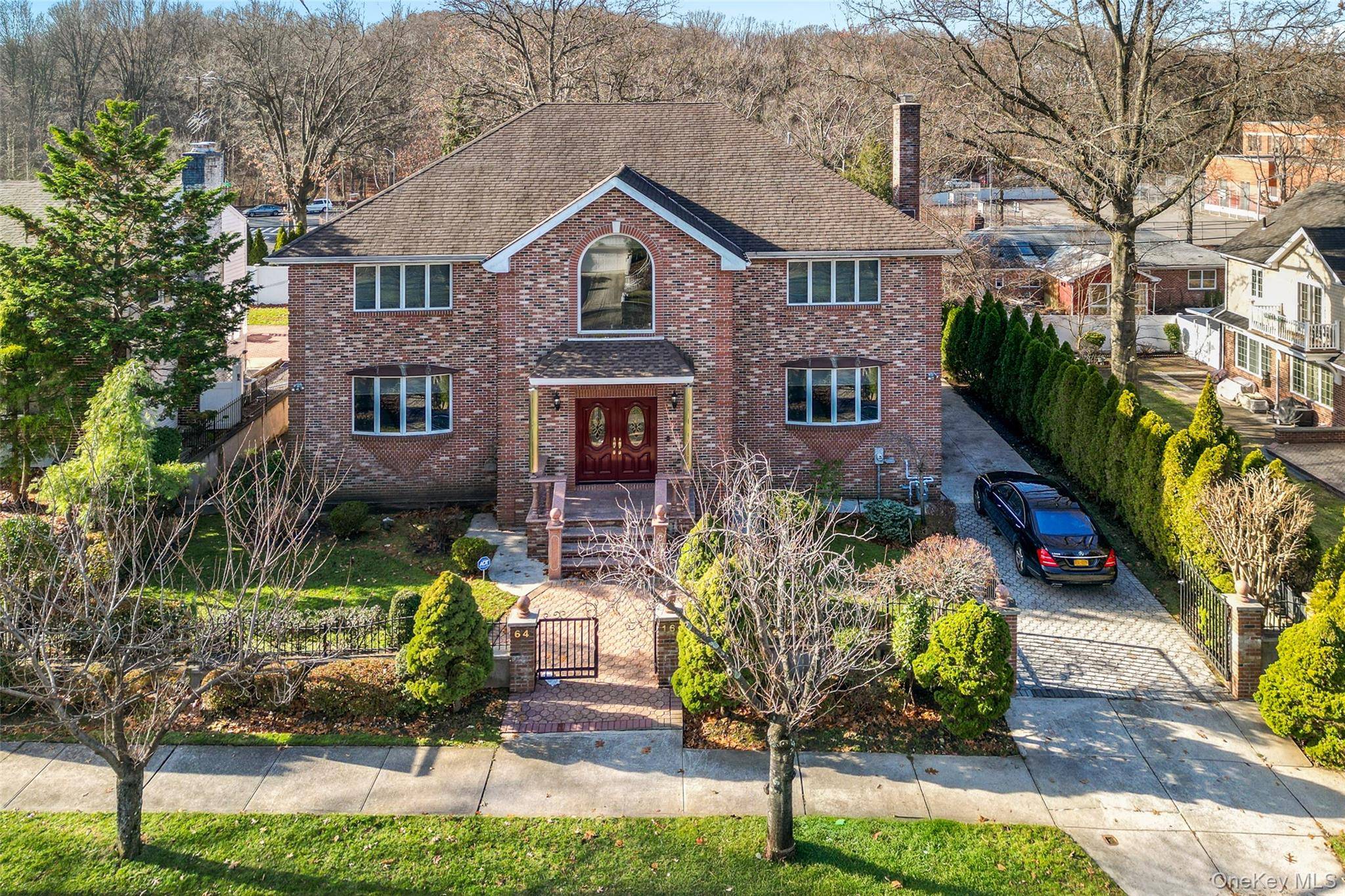 STUNNING ALL BRCIK COLONIAL MASTERPIECE SERENE SECTION OF BAYSIDE Spectacular 5BR 5BA home on oversized 80x100 lot offering 3, 890 sq ft of luxury living plus full finished basement w ...
