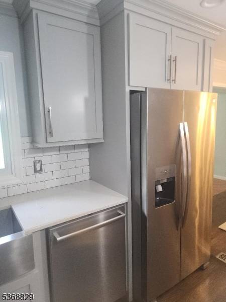 Home recently renovated with custom kitchen, stainless steel appliance with Bertazzoni stove.
