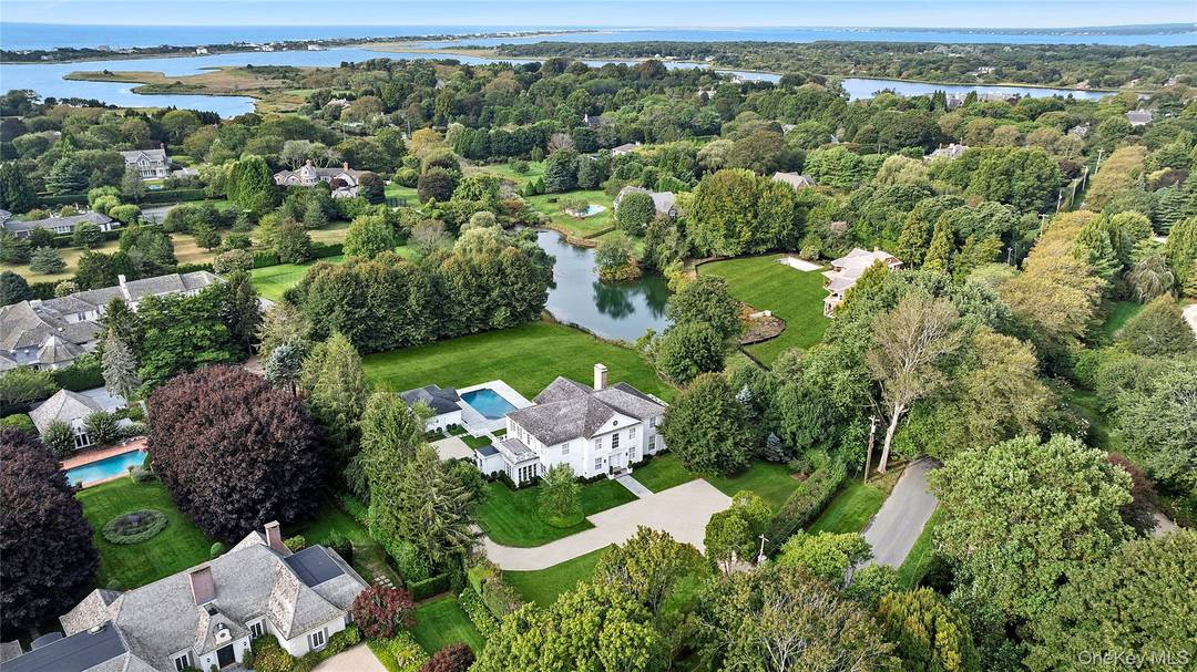 Tucked within the prestigious Estate Section of Southampton Village, south of the highway and set on 1.