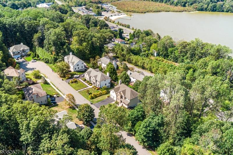 Discover this beautifully updated, Center Hall Colonial home in the sought after Lakeview Estates community, boasting stunning views of Budd Lake the surrounding mountains.