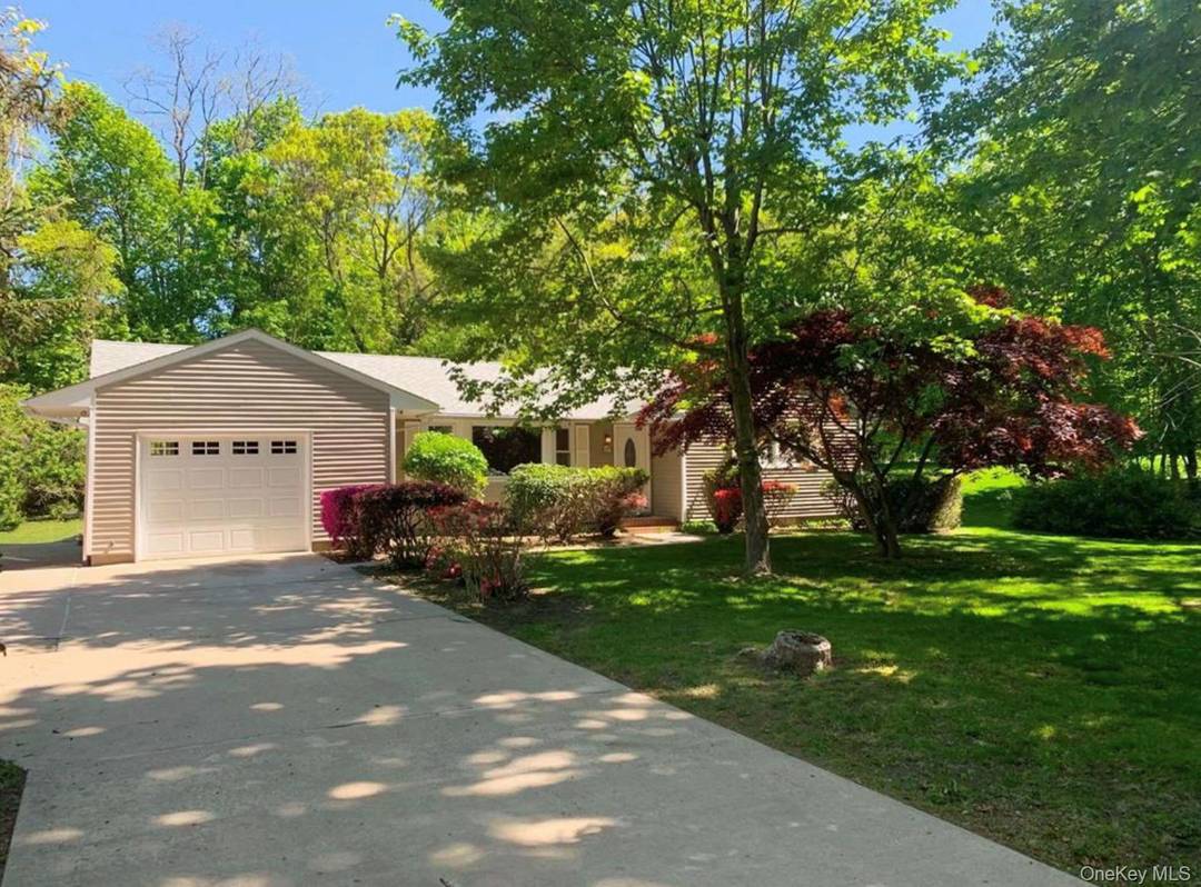 Beautifully remodeled and pristine ranch steps from the beaches in the heart of Port Jefferson Village.
