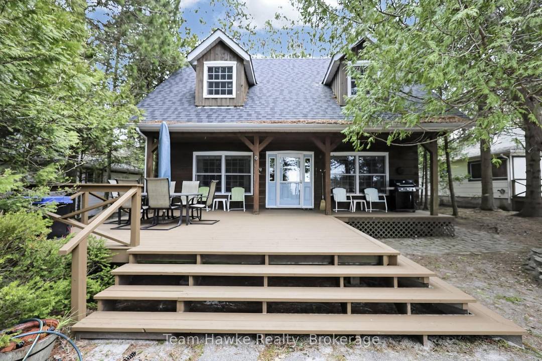 Discover a rare opportunity to own a prime waterfront retreat on the pristine shores of Wymbolwood Beach.