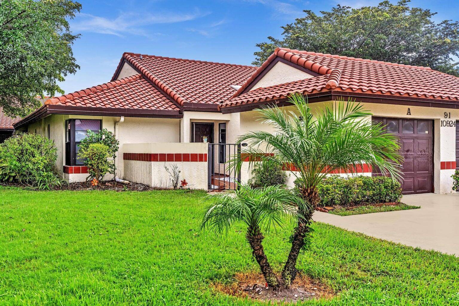 Remodeled 2 2 in the lovely villas of Palm Chase with 1 car garage attached.