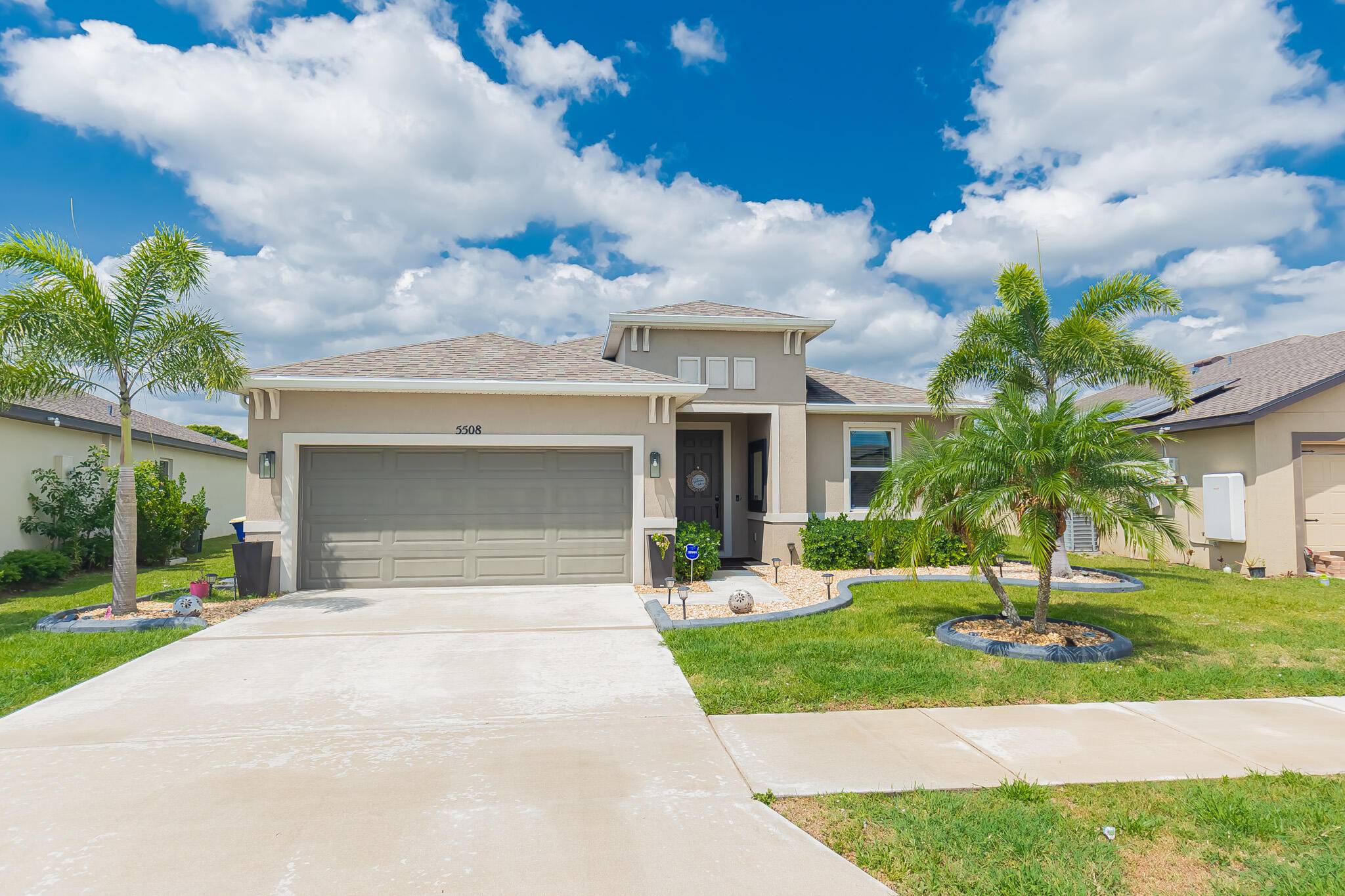 Celebration Pointe ! Indulge in glamorous lakefront living with this exquisite 3 bed, 2 bath den, 2 car garage masterpiece !