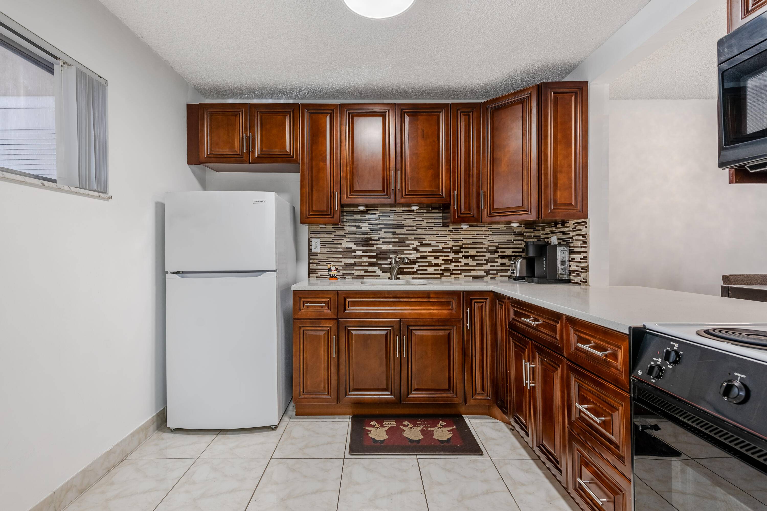 Charming second floor condo nestled within a tranquil 55 community, perfect for those seeking a peaceful and convenient lifestyle.