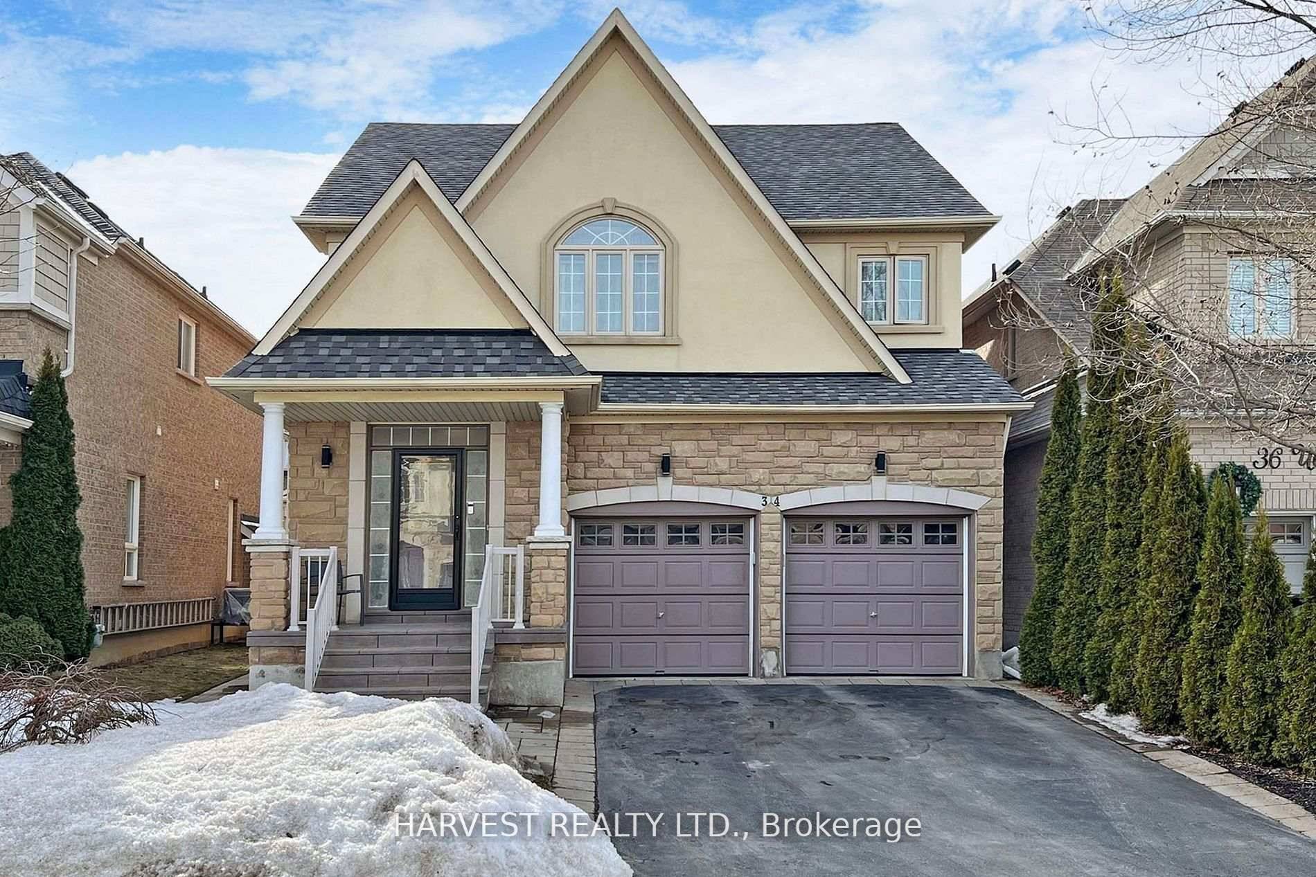 Beautifully upgraded home with elegant stucco and stone exterior.