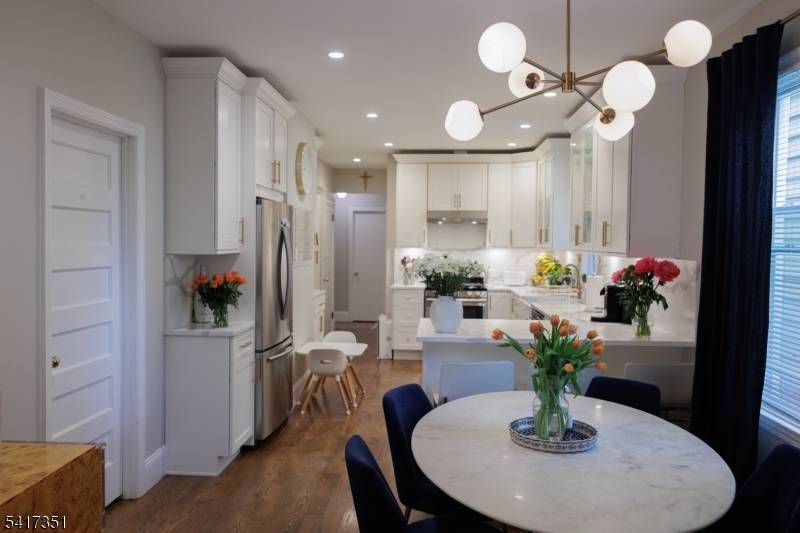 Fully renovated, open concept apartment featuring three bedrooms on the first floor, an oversized formal family room, dining room, and large chefs kitchen with a breakfast island, quartz countertop stainless ...