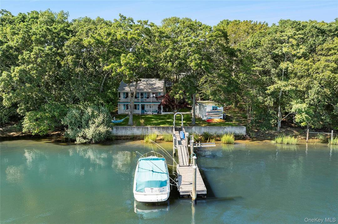 This unique waterfront offering boasts an unprecedented 228 feet of water frontage in the highly sought after Redwood Island neighborhood of Sag Harbor Village.