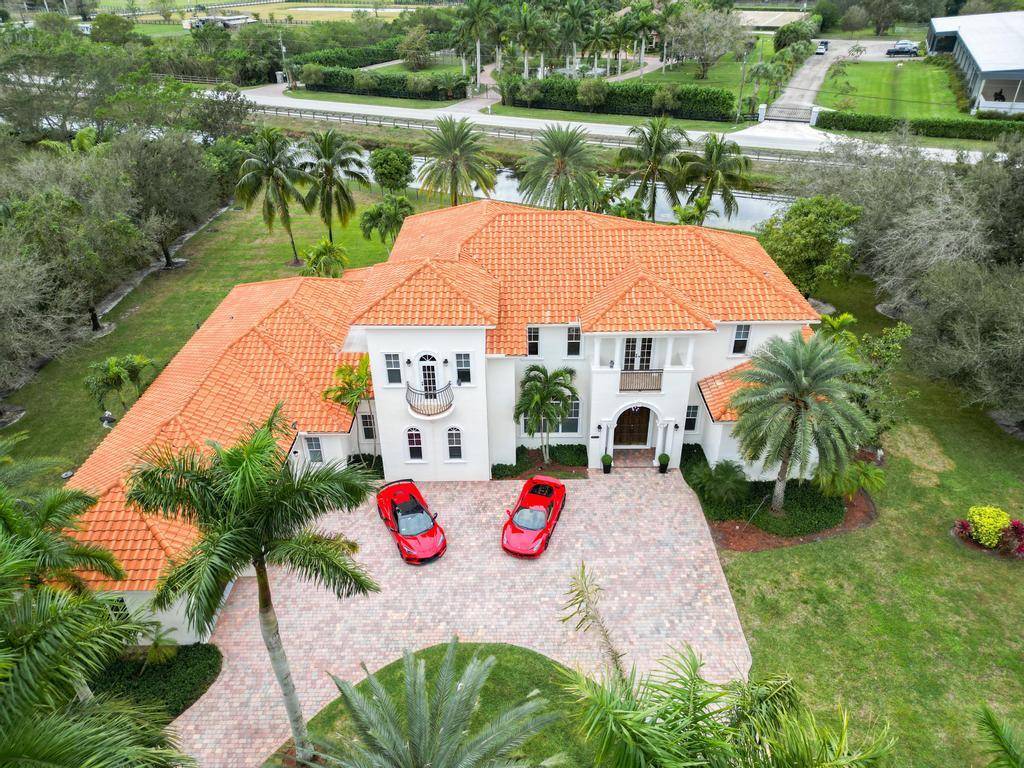 Experience unparalleled luxury in this 6, 823 sq ft under air, gated estate on 1.