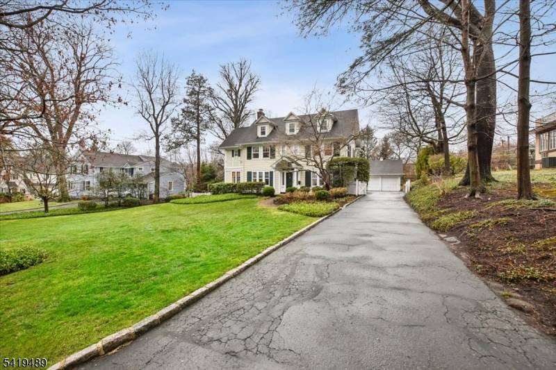 Resting on nearly half an acre of land, this center hall colonial home enjoys a beautiful and quiet setting in the highly sought after Glenwood section of Short Hills.