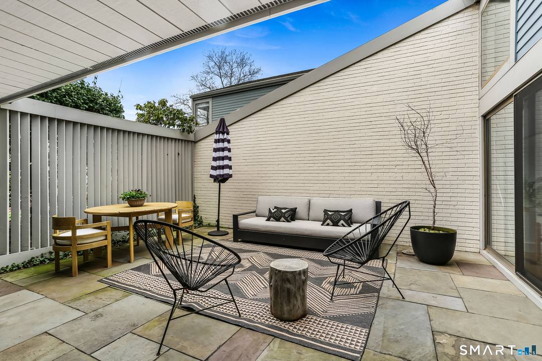 Beautifully updated with main level primary suite and abundant additional living space for family and guests in this move in ready townhouse.