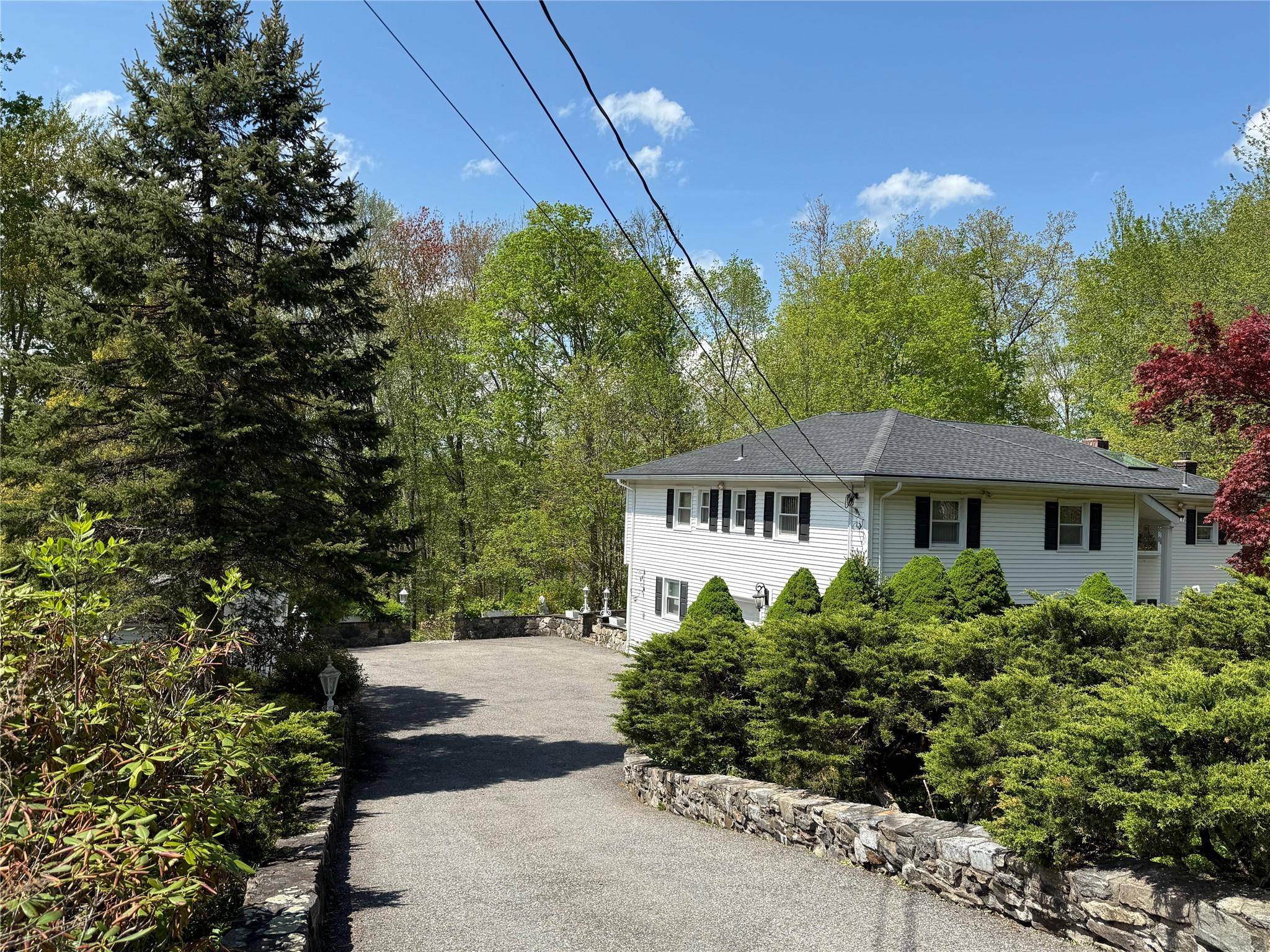 Welcome to your own private, secluded oasis on over 1 acre of land, complete with mature landscaping, stunning masonry work and attached 2 car garage.
