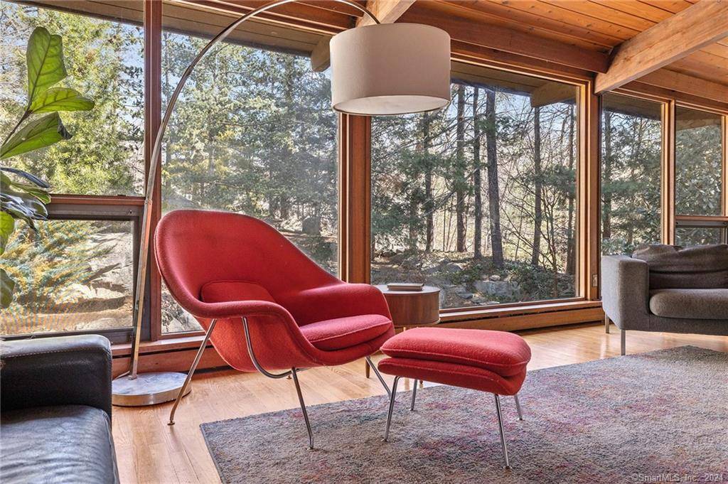 This 4 bedroom, 3. 5 bath Mid Century deck house, set on a private acre, beautifully blends retro charm with modern style.