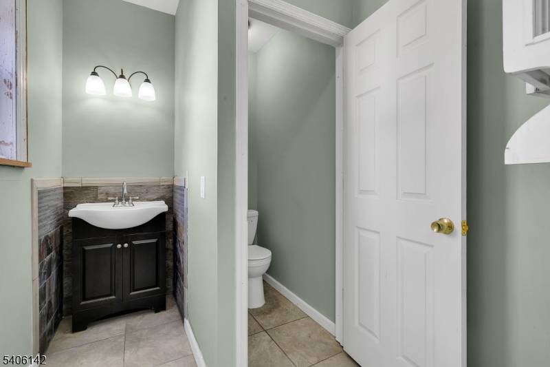 Welcome to this updated 3 bedroom, 2nd floor apartment paired with a freshly renovated mixed use storefront below.